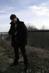 Coat with gloves on